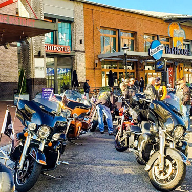 Rows of motorcycles outside of Blue Moon TapHouse