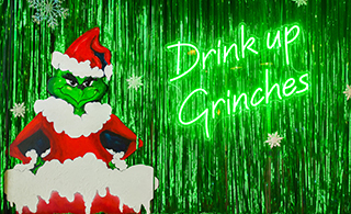 Drink up Grinches Miracle on Waterside Drive photo op wall